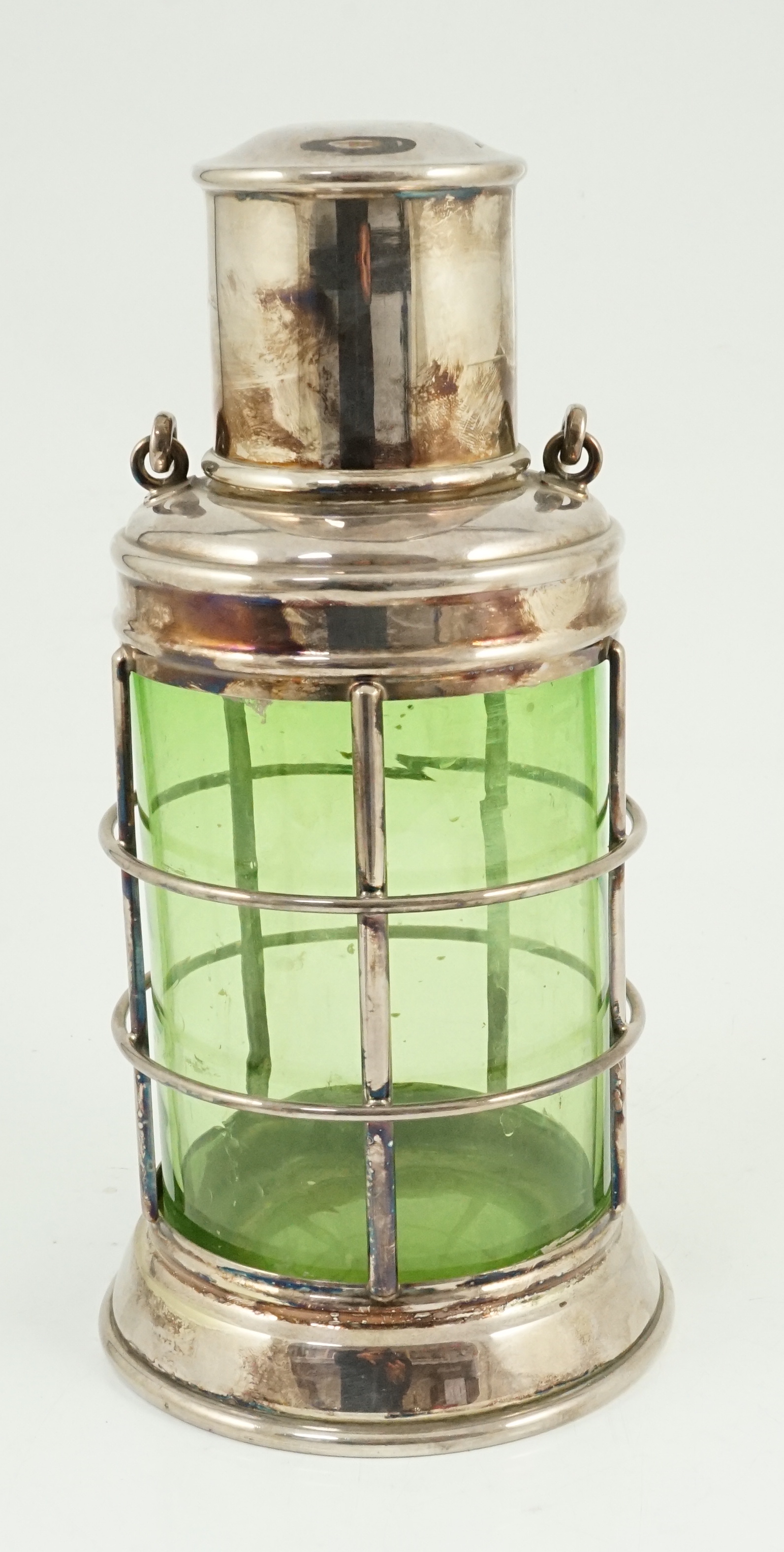 An Asprey & Co. silver plated and green glass novelty cocktail shaker in the form of a lantern